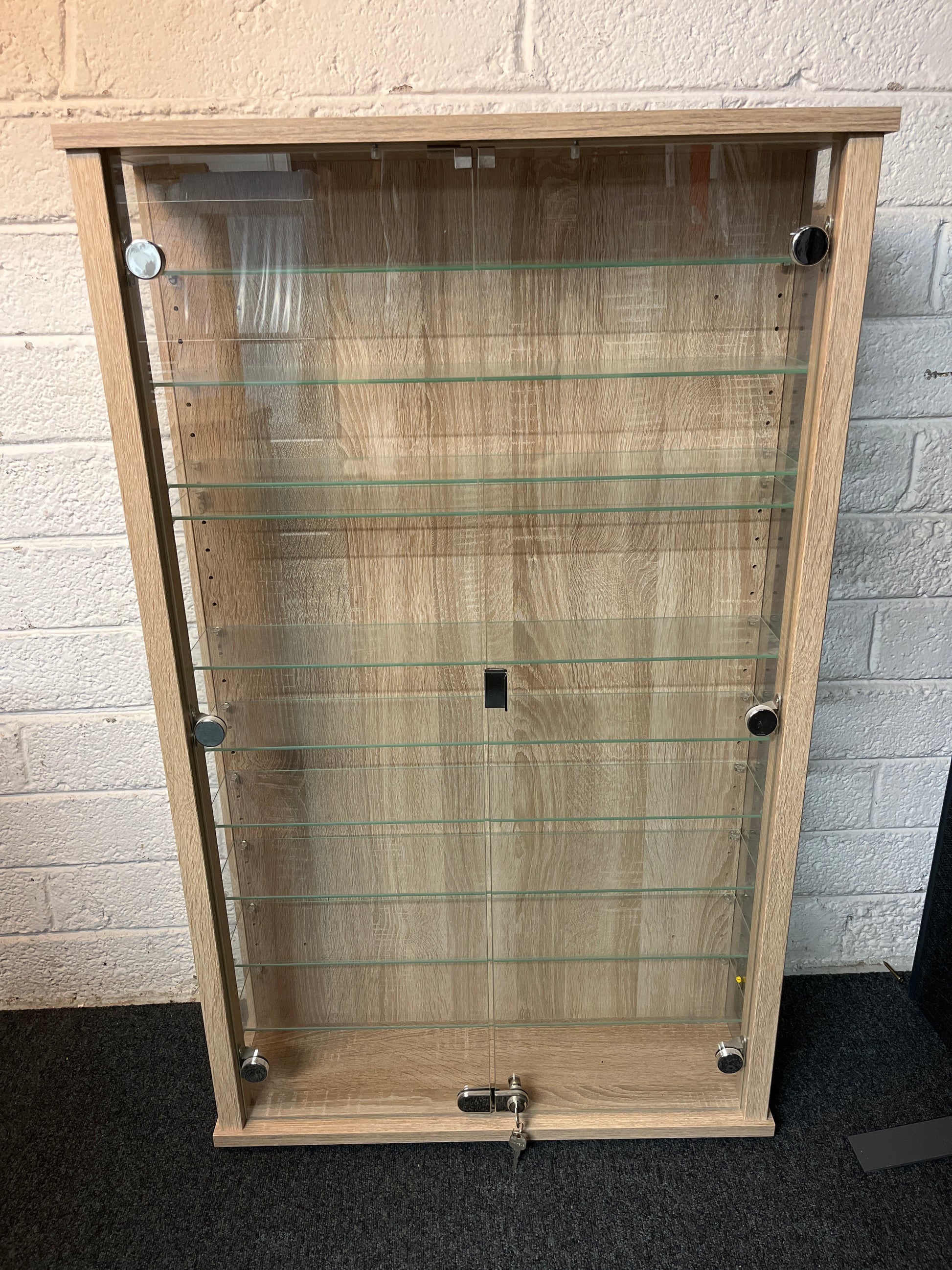 Oak laminate 2 glass door display unit with shelves and key 1100Hx670Wx195D  2225