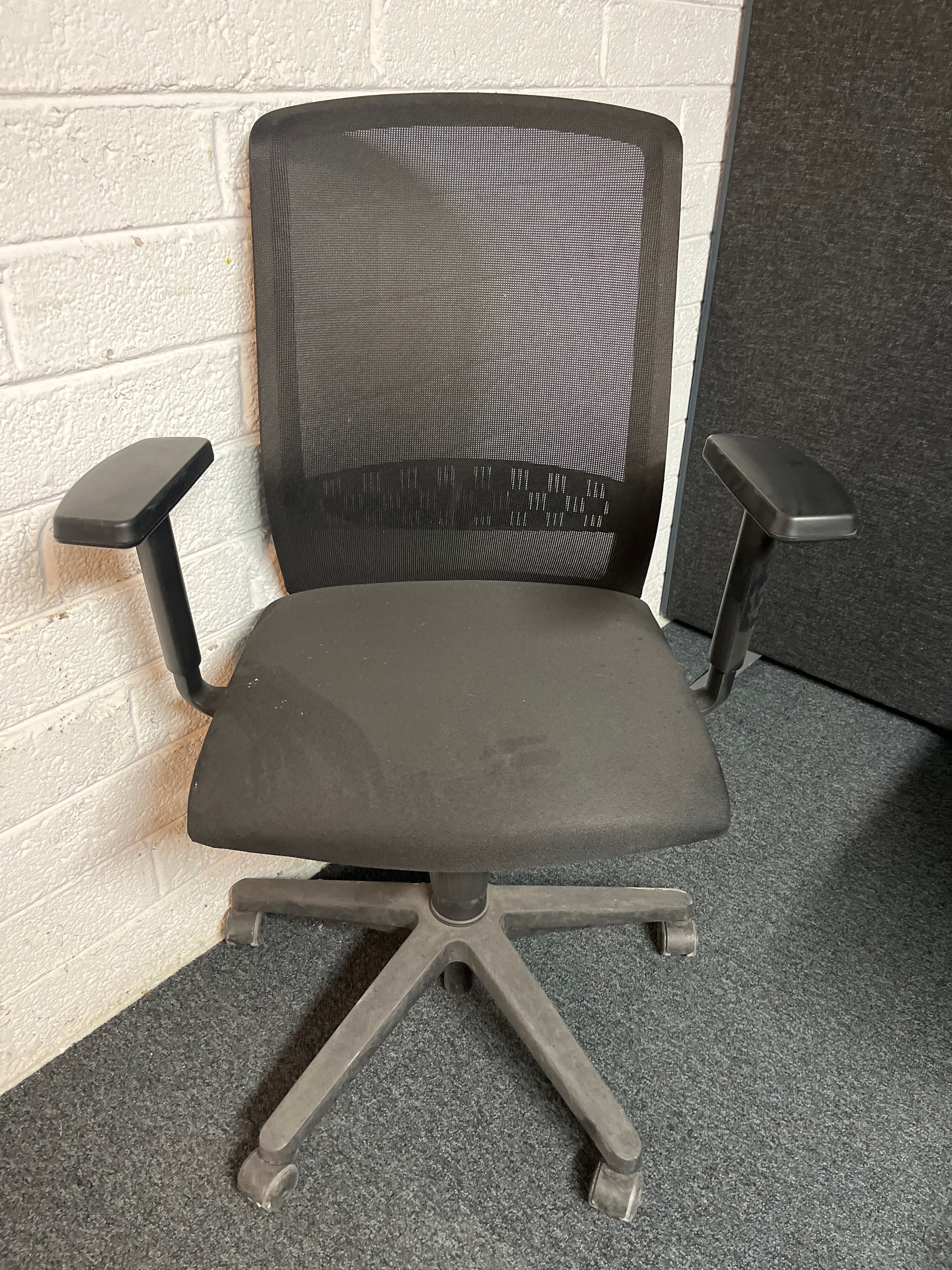 SECONDHAND Mesh back black fabric height adjustable swivel with adjustable arms
