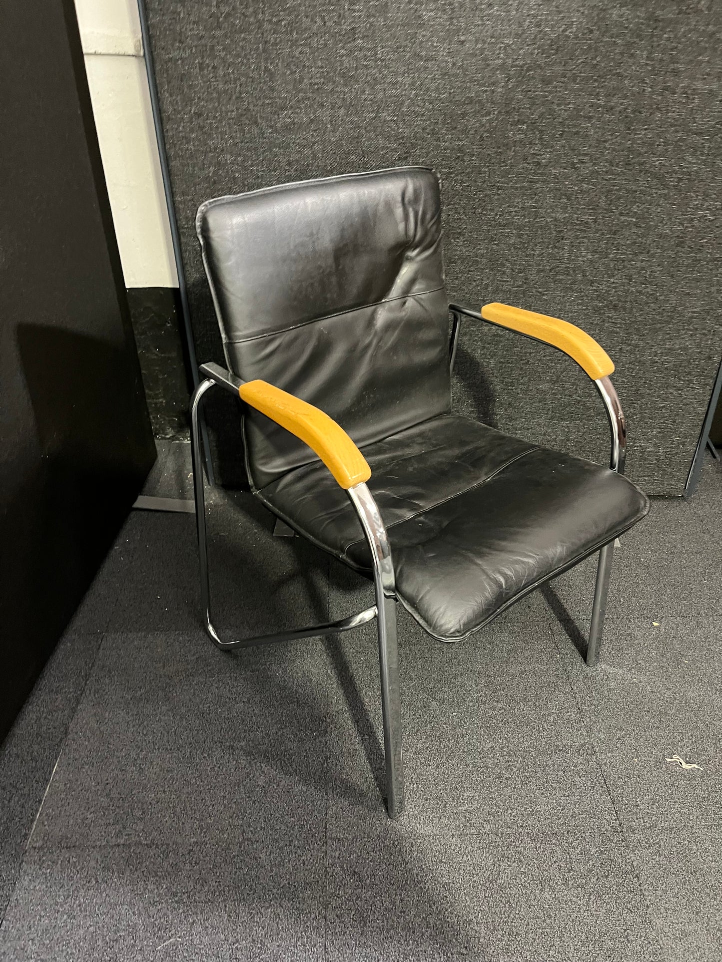 Black leatherette chrome framed stacking chair with wooden arms  1425