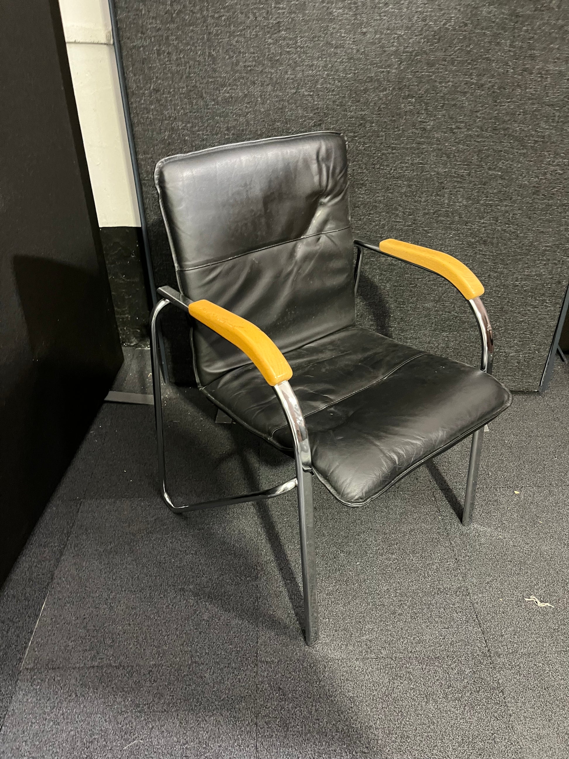 Black leatherette chrome framed stacking chair with wooden arms  1425