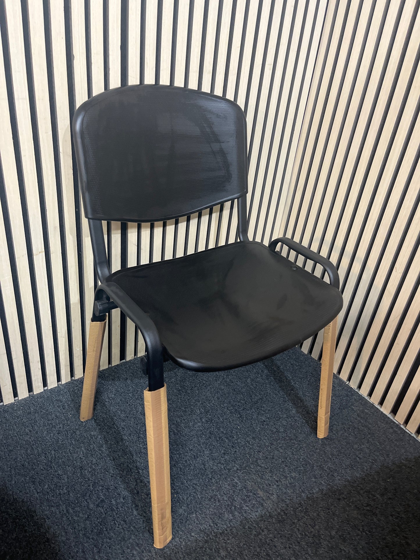 NEW black plastic taurus stacking chair with solid metal frame