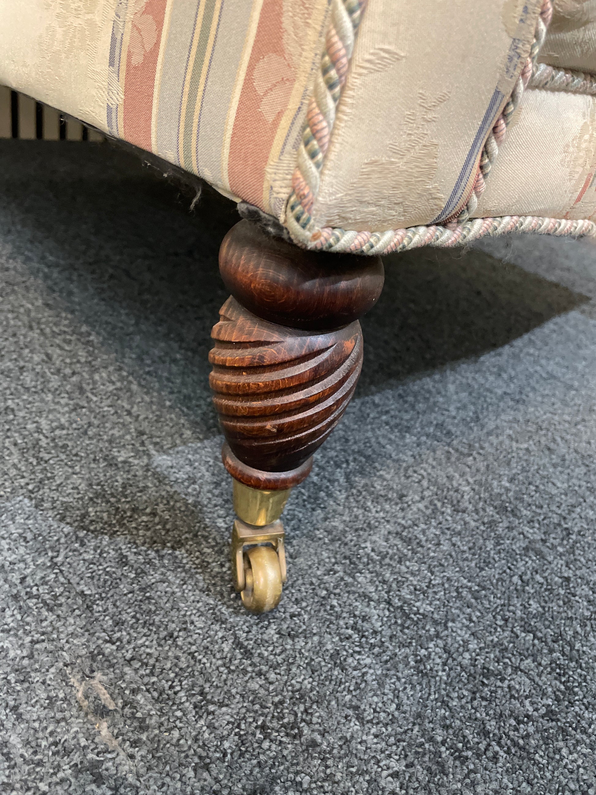 Ornate roll back stripped fabric armchair with castors 2425