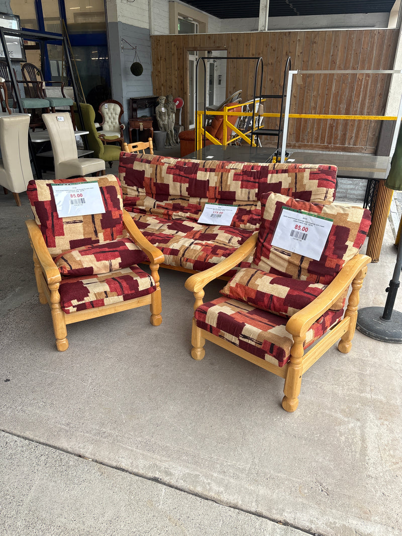 Three-seater futon with patterned fabric mattress and light wood frame.  44740