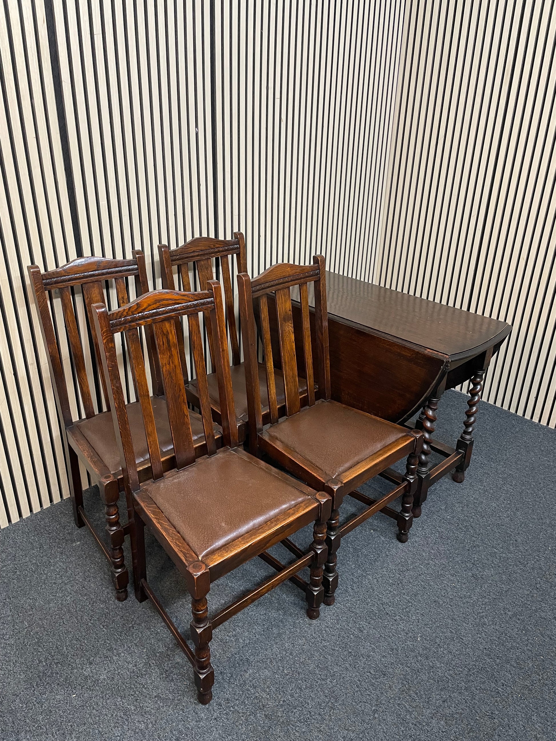 Drop leaf dark oak stained oval dining table, barley twist legs (W 109 x L 135 cm) with 4 no. matching chairs  3126