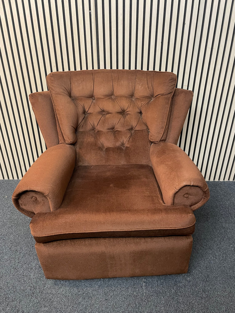 Brown fabric button back fireside armchair on castors 2425