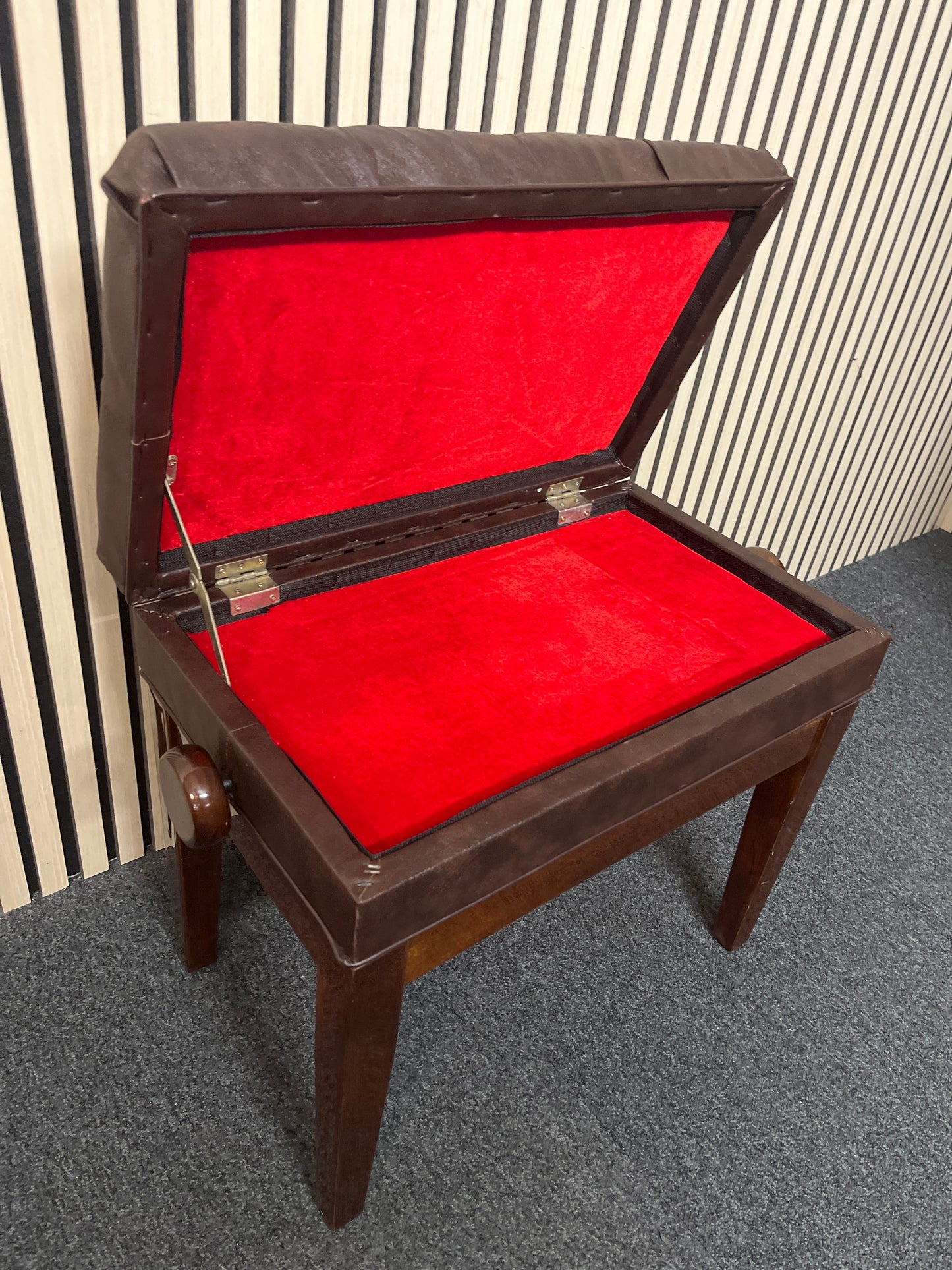 Solid wood frame leather top adjustable piano stool with leatherette seat studded seat and lift up cover with red felt internal fabric 2325