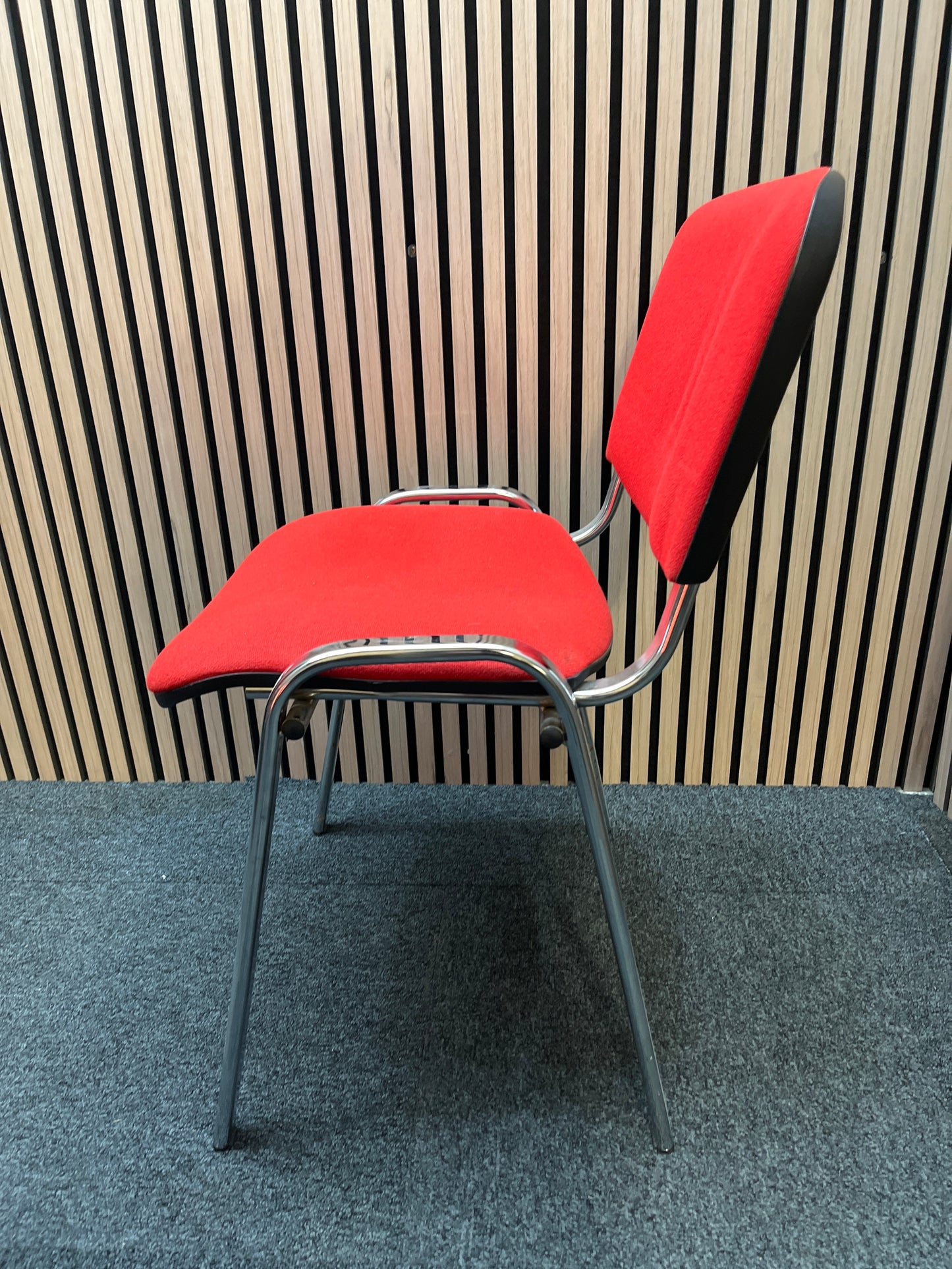 Red fabric stacking conference chair with chrome frame