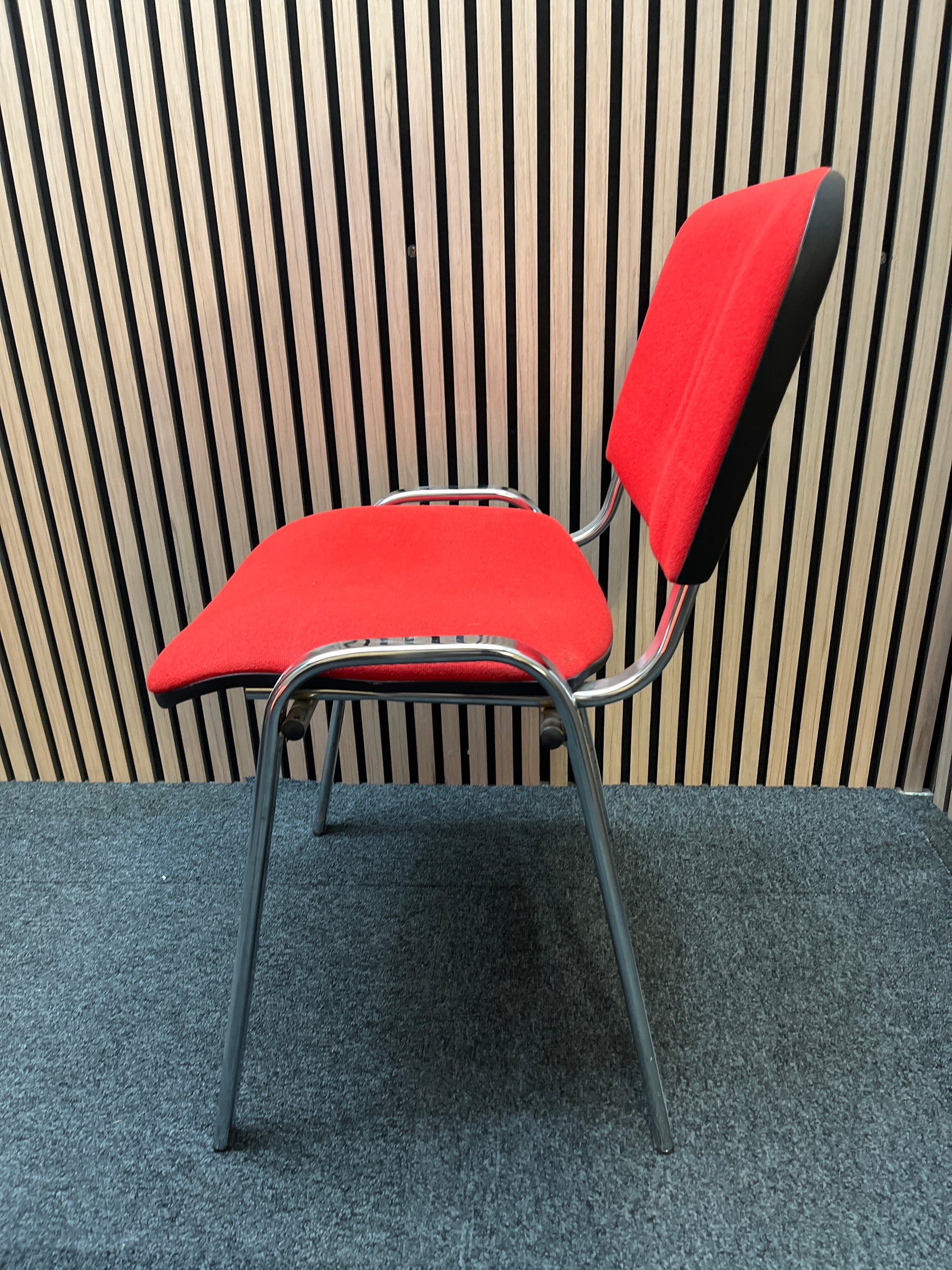 Red fabric stacking conference chair with chrome frame