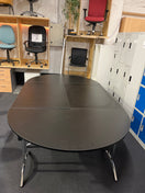 Switch Large black oval shaped boardroom table  (length 2.8 m width 1.6 m) comprised of 2 black semi-circular foldable desks and 2 black straight foldable desks 2 image