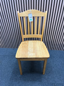 Set of two light wood dining chairs with slatted backrests.  44409