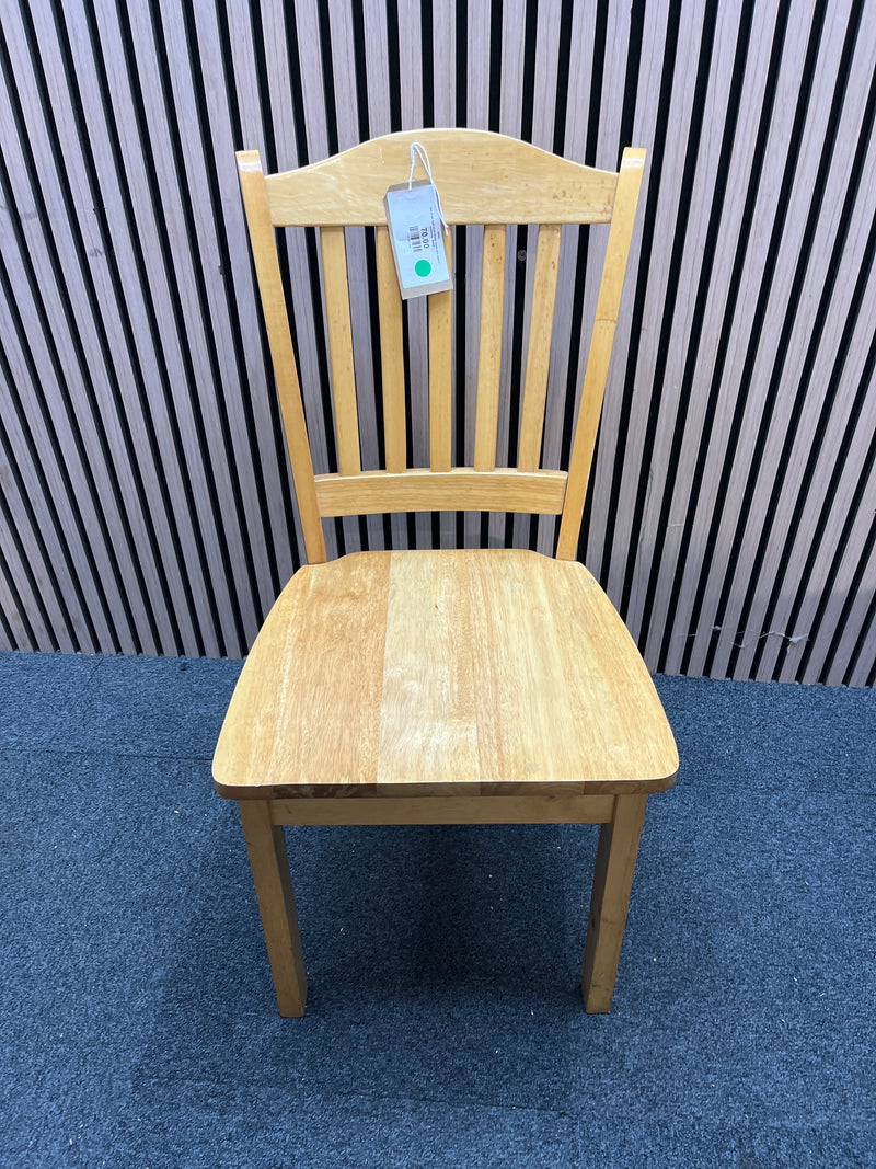 Set of two light wood dining chairs with slatted backrests.  44409