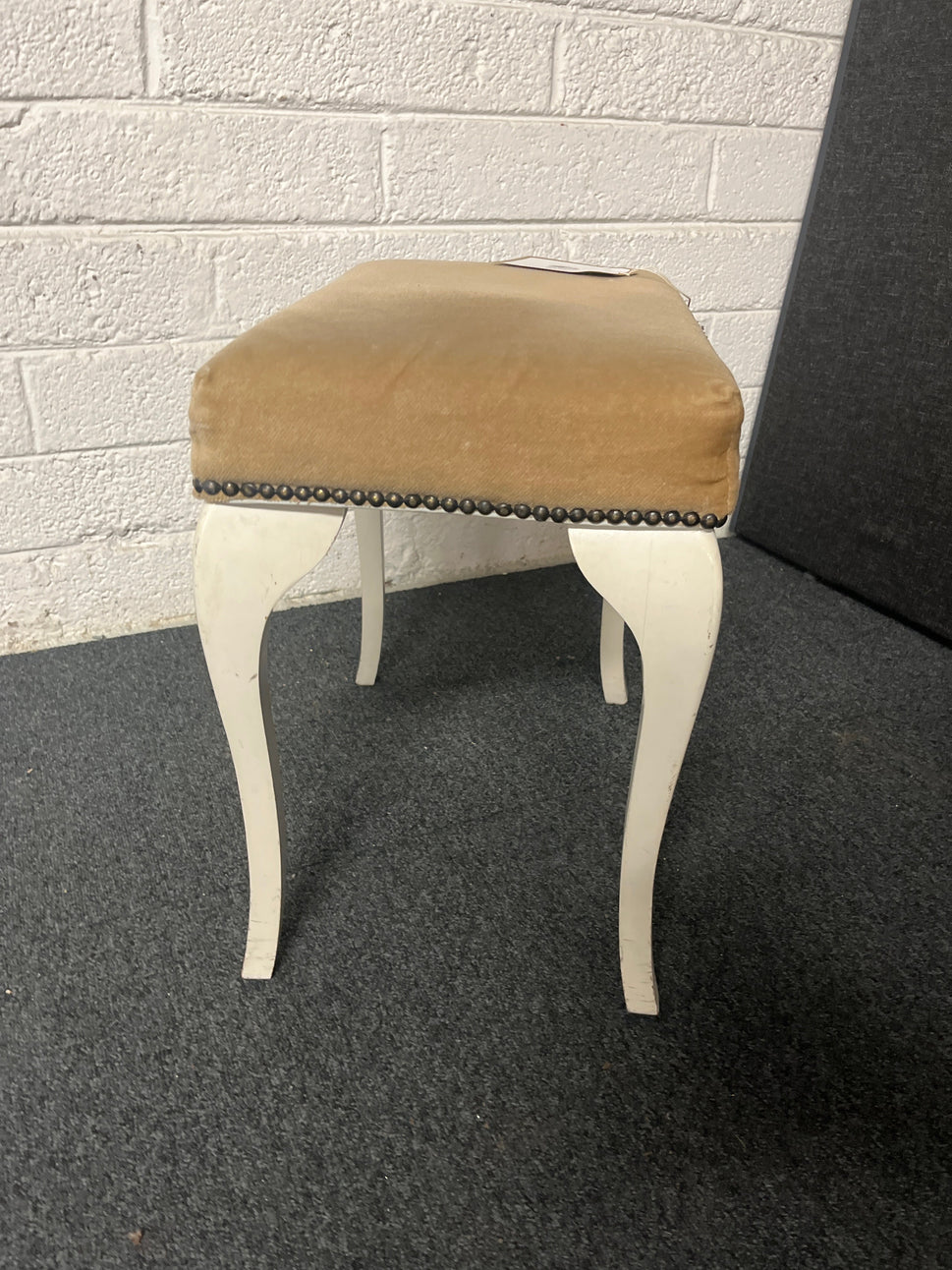 Brown fabric footstool with white legs  1225