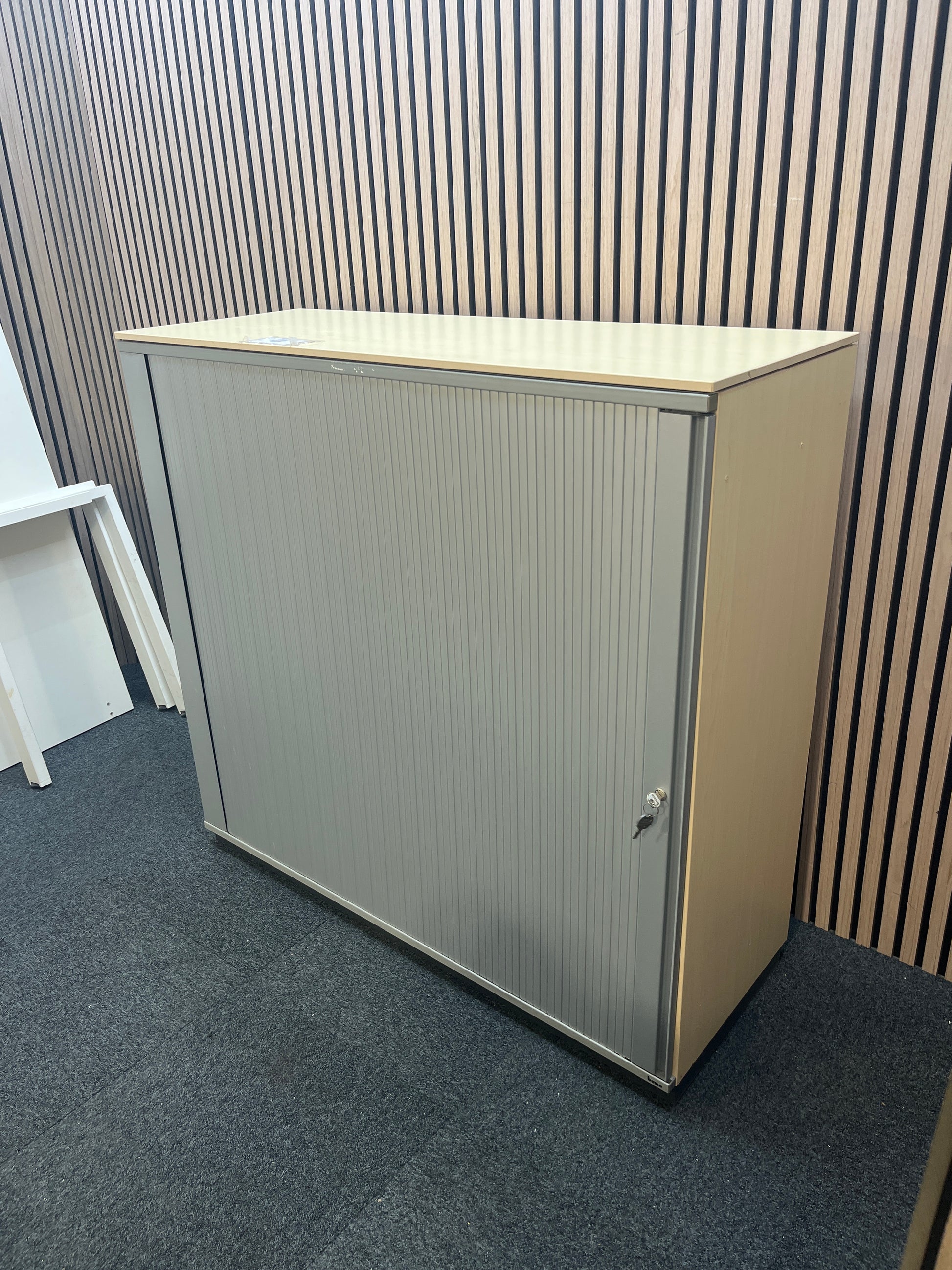 Maple laminate silver framed, side opening tambour with internal shelves (H 113 x W 120 x D 44 cm) J3847