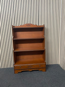 Traditional wooden bookcase featuring carved details and a bottom drawer, height 119cm, width 76 cm, depth 30 cm  44741