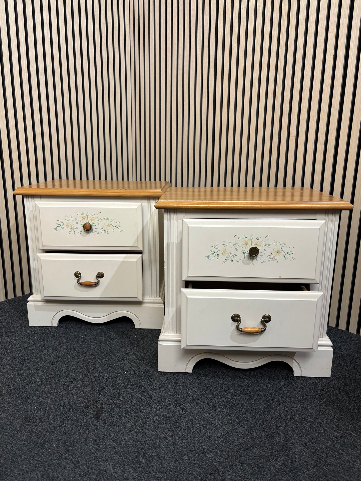 White nightstand with floral detailing and two drawers