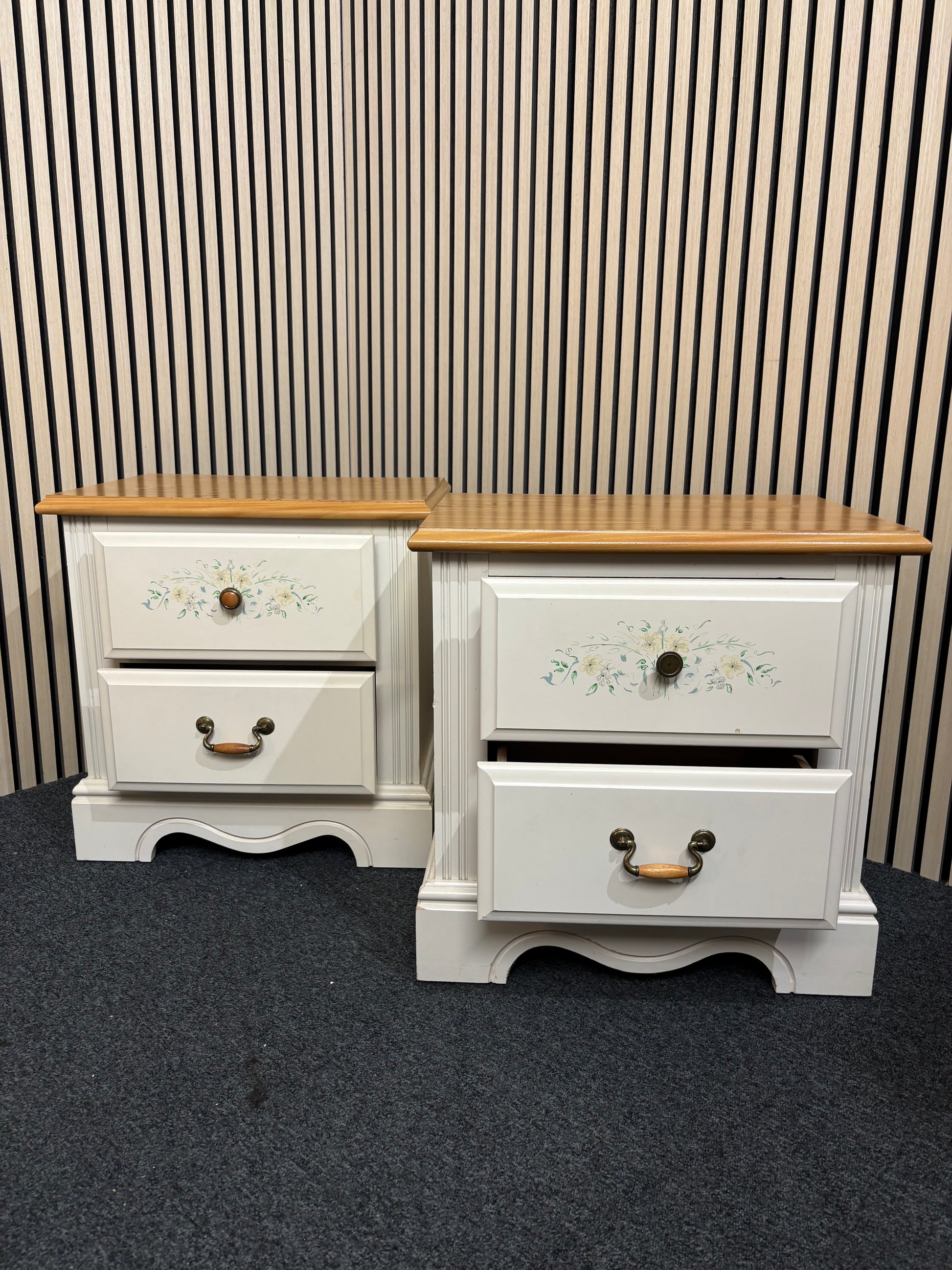 White nightstand with floral detailing and two drawers