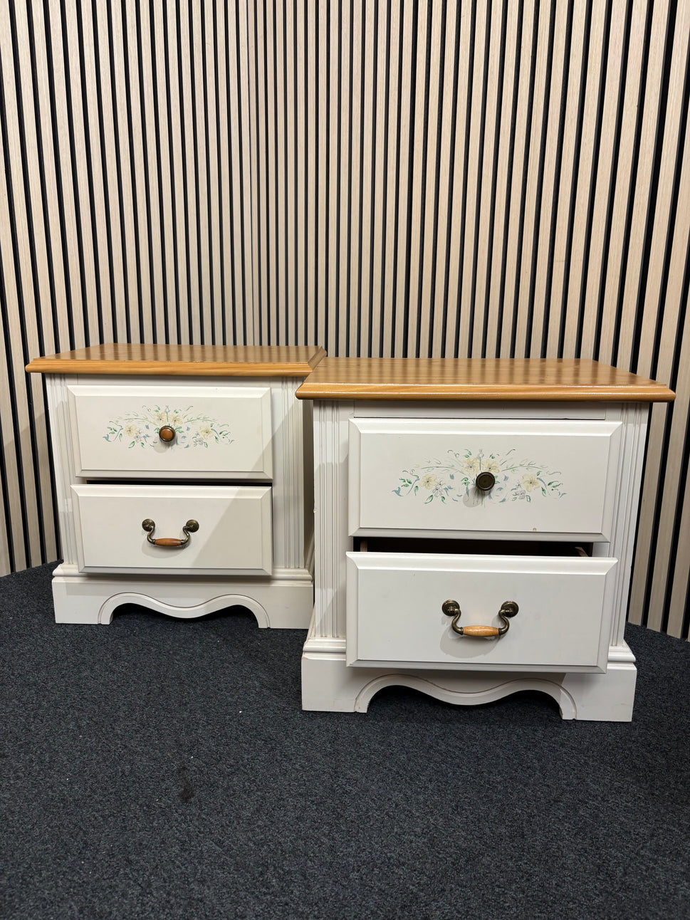 White nightstand with floral detailing and two drawers