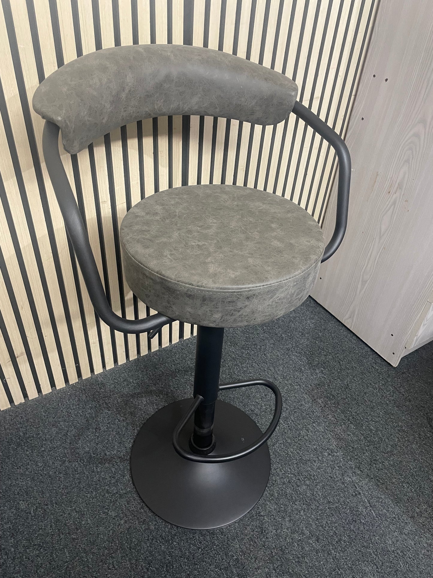 Black metal framed height adjustable swivel bar stool with back in grey fabric  44063