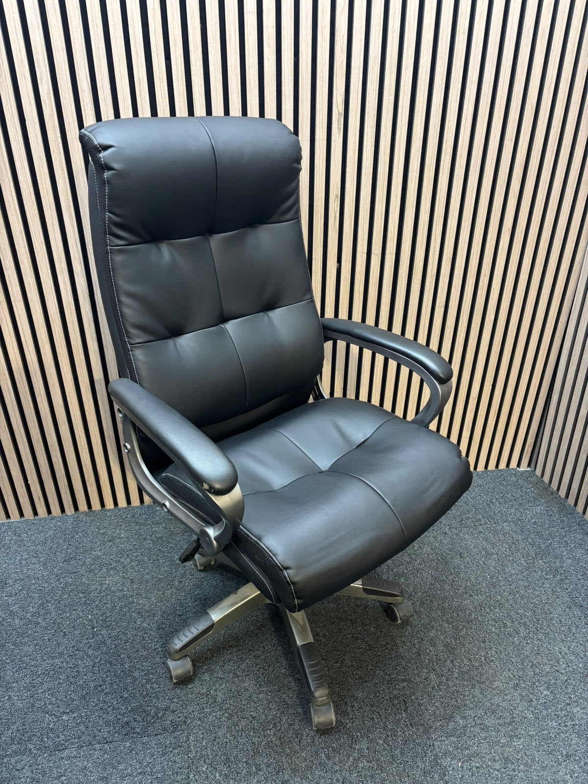 Padded black faux leather executive swivel chair, high back with arms  J3950