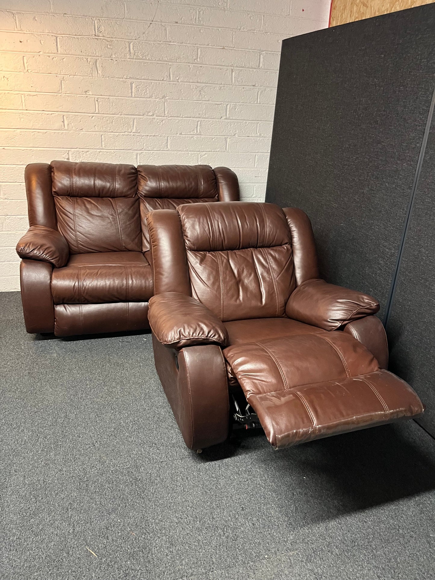 Dark brown leather 2 seater and matching rocking recliner armchair 2225