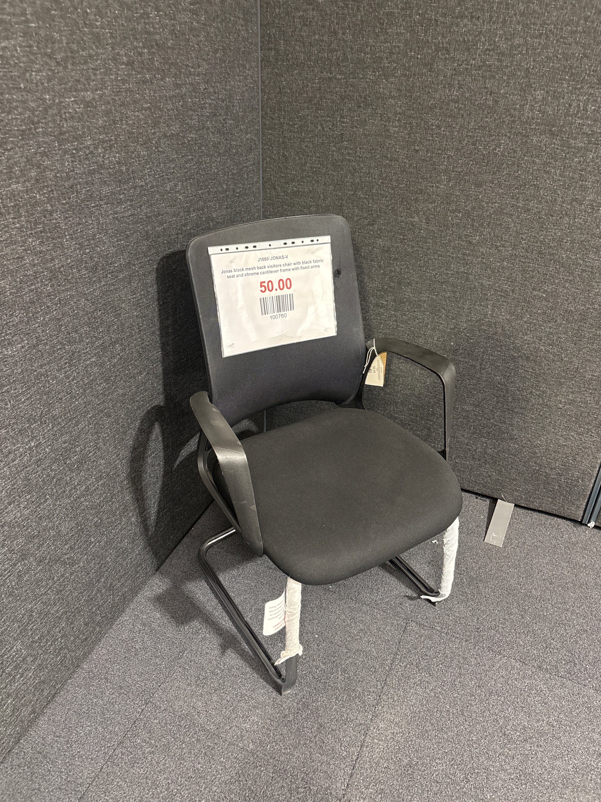 Jonas black mesh back visitors chair with black fabric seat and chrome cantilever frame with fixed arms