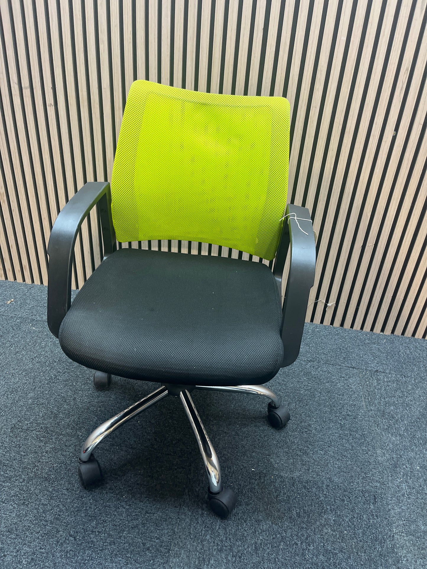 Neon green and black fabric swivel chair with loop arms