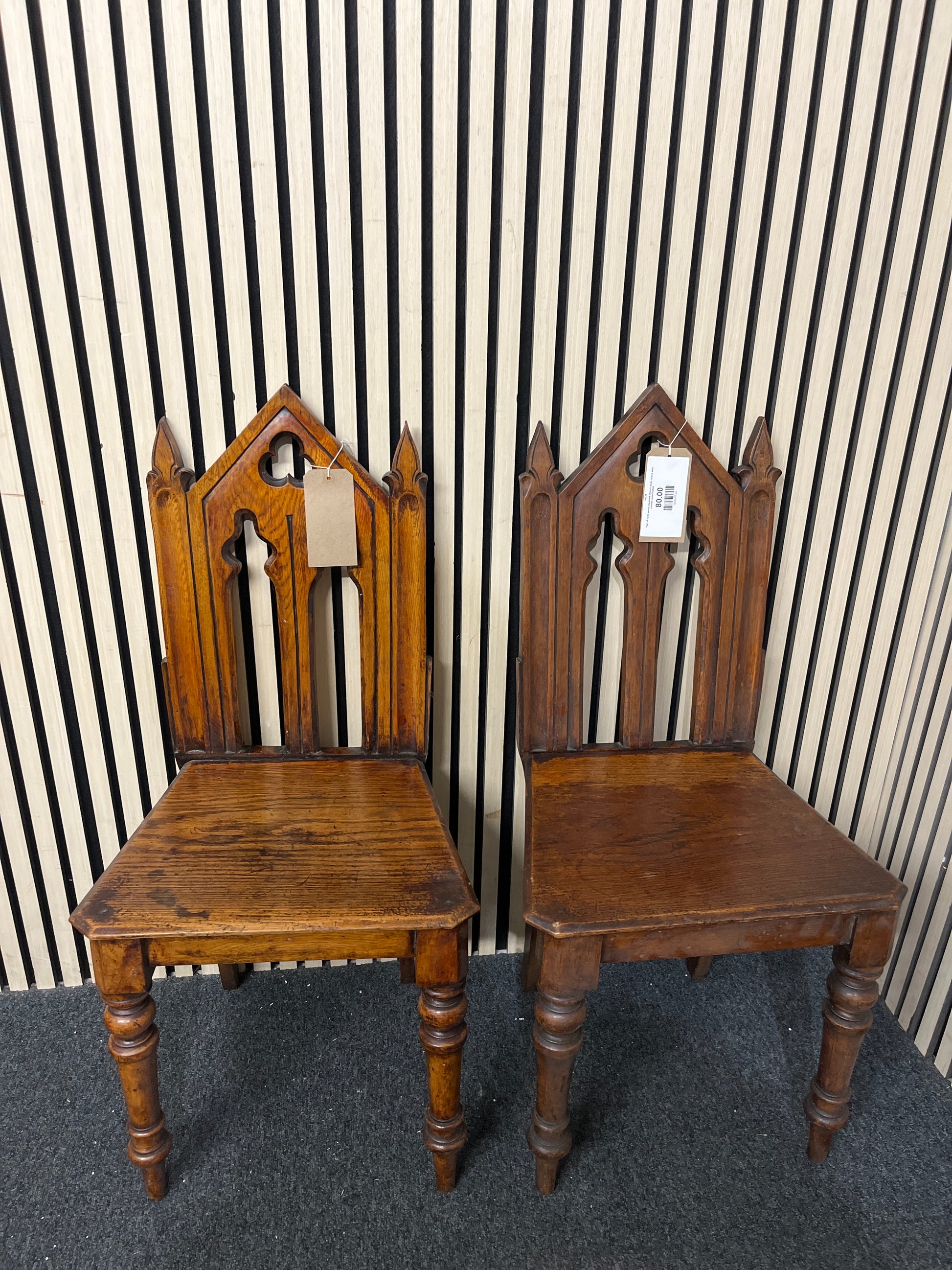 Pair of solid wood stsained church style chairs with carved detail 43538