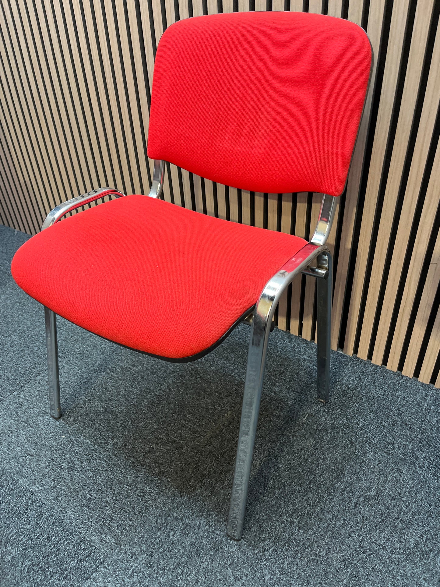 Red fabric stacking conference chair with chrome frame