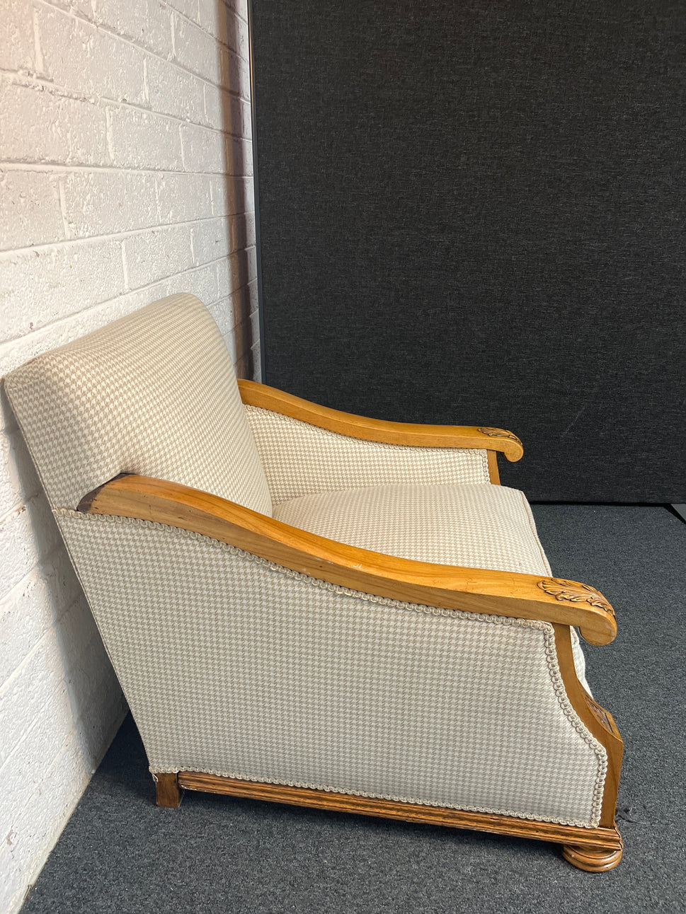 Antique solid oak framed ornate carved detail wing back armchair with  cream chequered fabric 2225