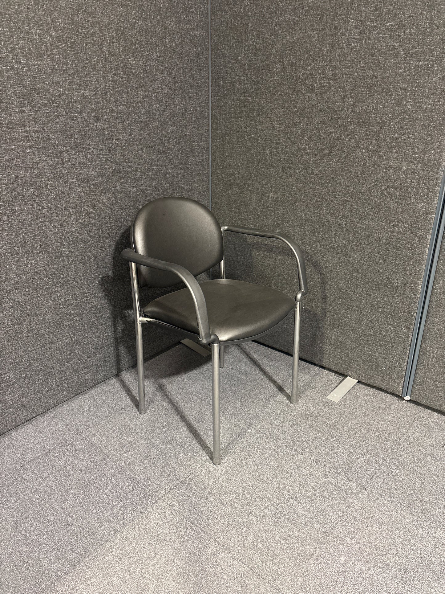 Chrome framed stacking Coda meeting chair with arms in black vinyl. Price inc VAT, Ex Demo stock, Like NEW