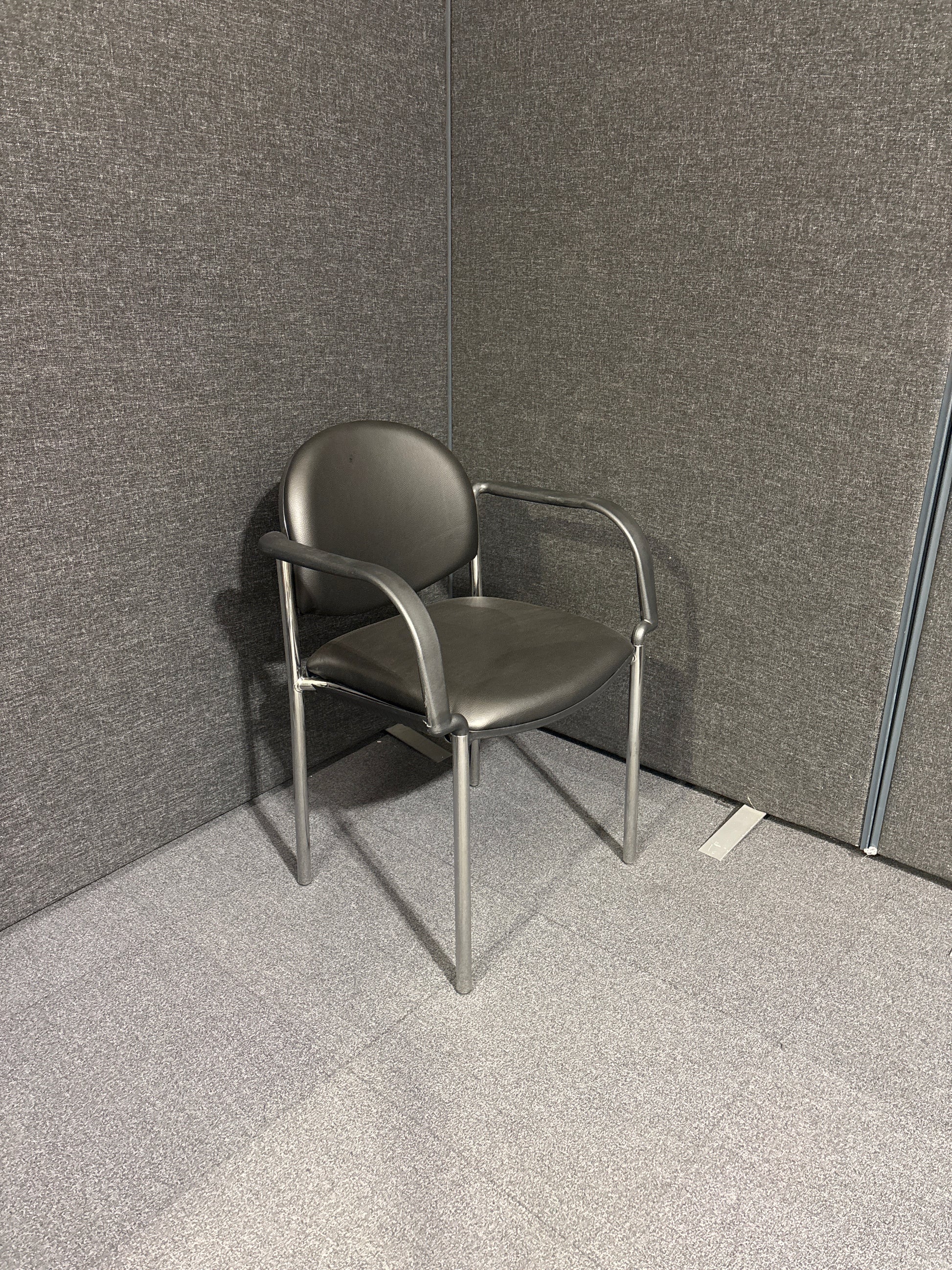 Chrome framed stacking Coda meeting chair with arms in black vinyl. Price inc VAT, Ex Demo stock, Like NEW