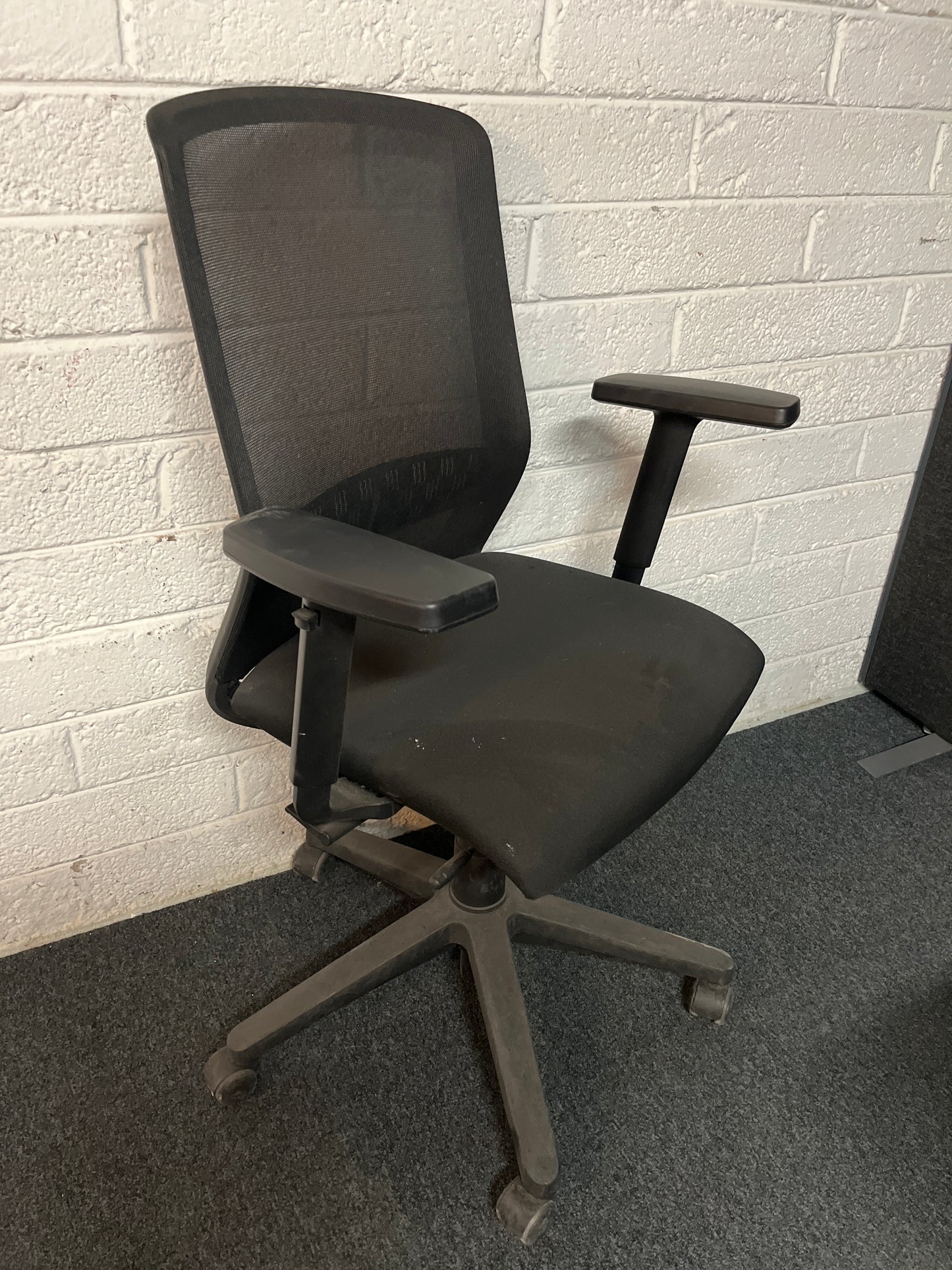 SECONDHAND Mesh back black fabric height adjustable swivel with adjustable arms
