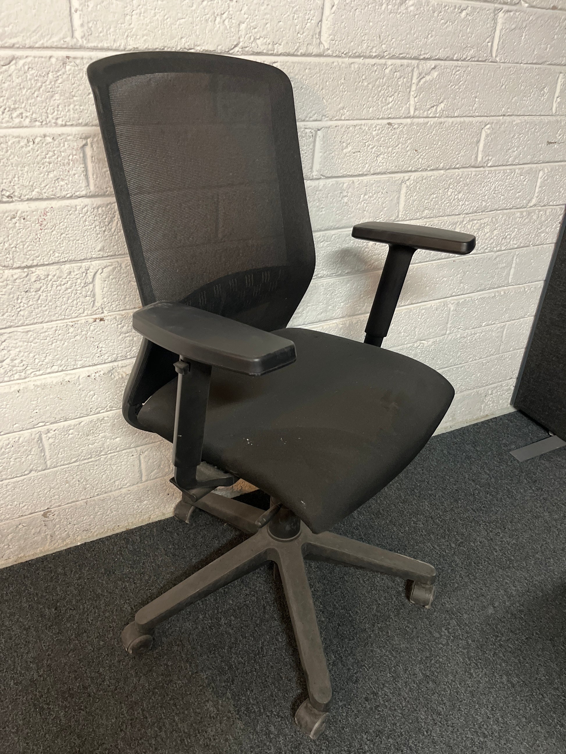 SECONDHAND Mesh back black fabric height adjustable swivel with adjustable arms