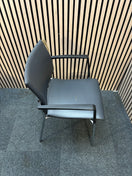 Black pu leatherette stacking chair with arms