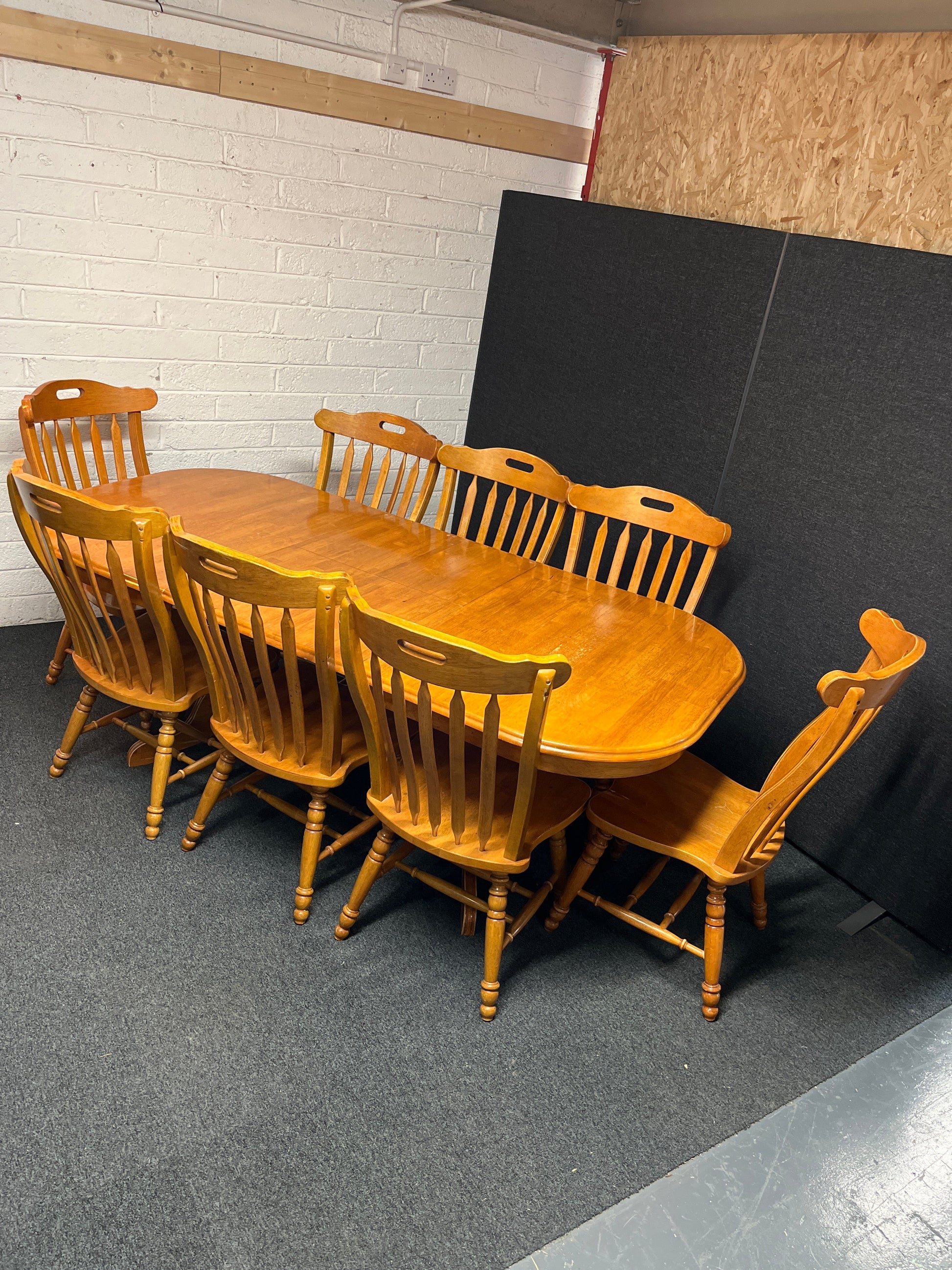 Large hardwood oval extendable dining table (L 155 - 215 x W 105 cm) with 8 no. matching high back solid wood chairs 2225