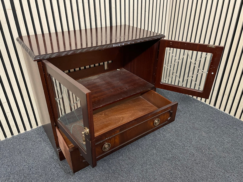 Dark wood TV unit with leaded glass doors and drawers.  44509