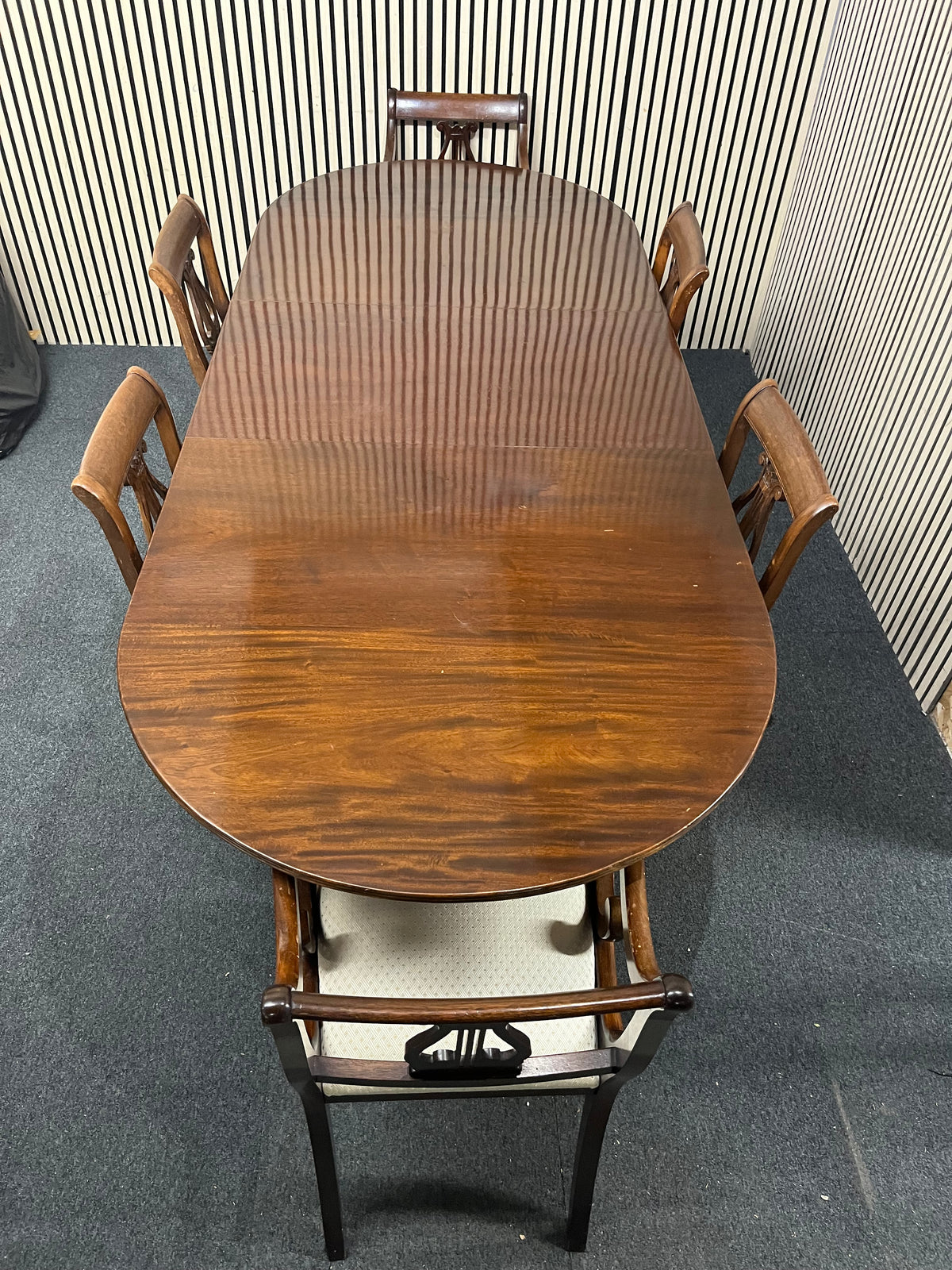 Mahogany dining set including oval pedestal table and six chairs.  44369