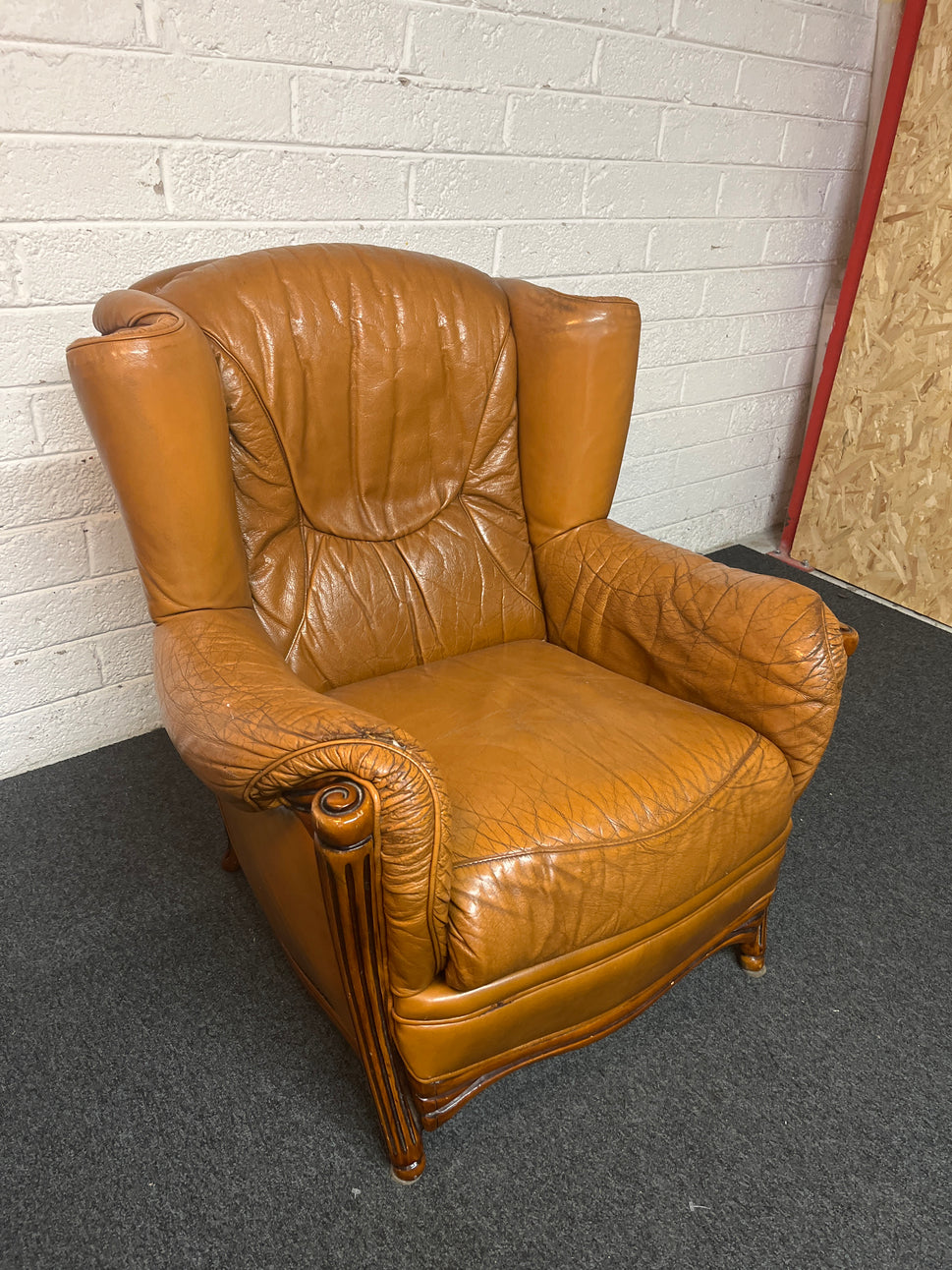 Real tan leather armchair with oak frame