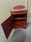 Traditional dark wood nightstand with decorative edges and single drawer.  44667