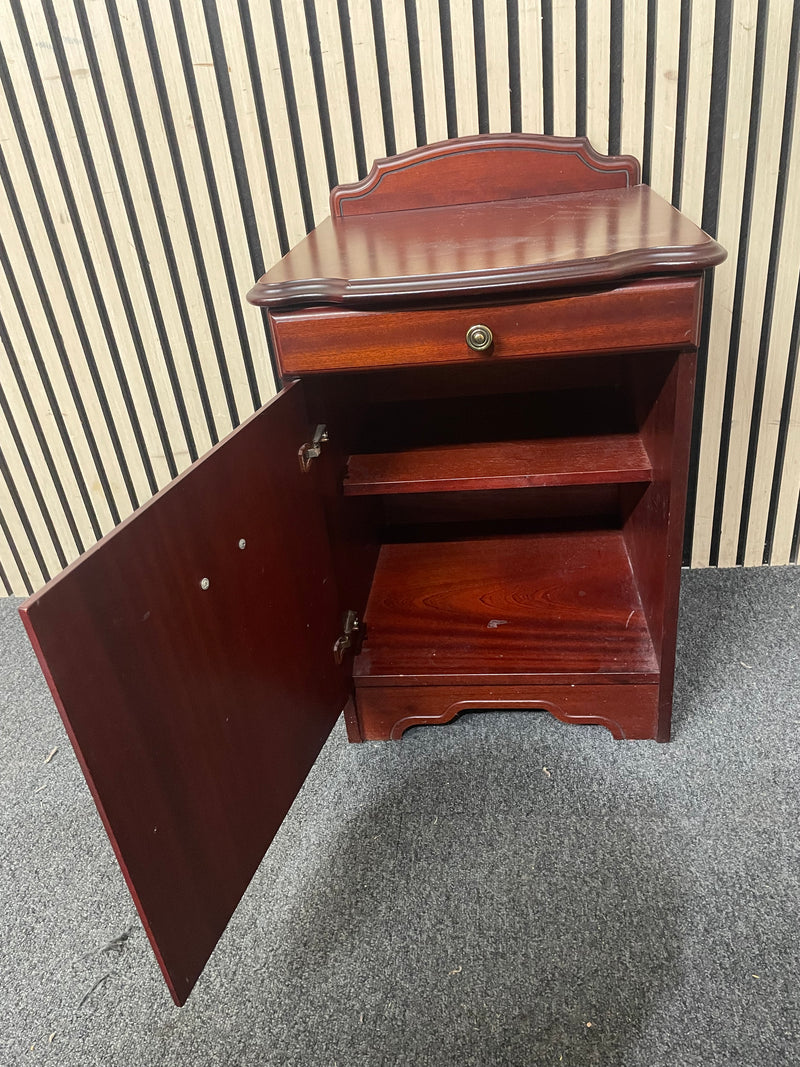 Traditional dark wood nightstand with decorative edges and single drawer.  44667