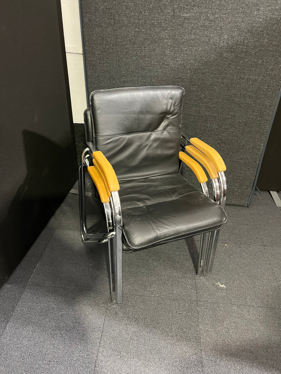 Black leatherette chrome framed stacking chair with wooden arms  1425
