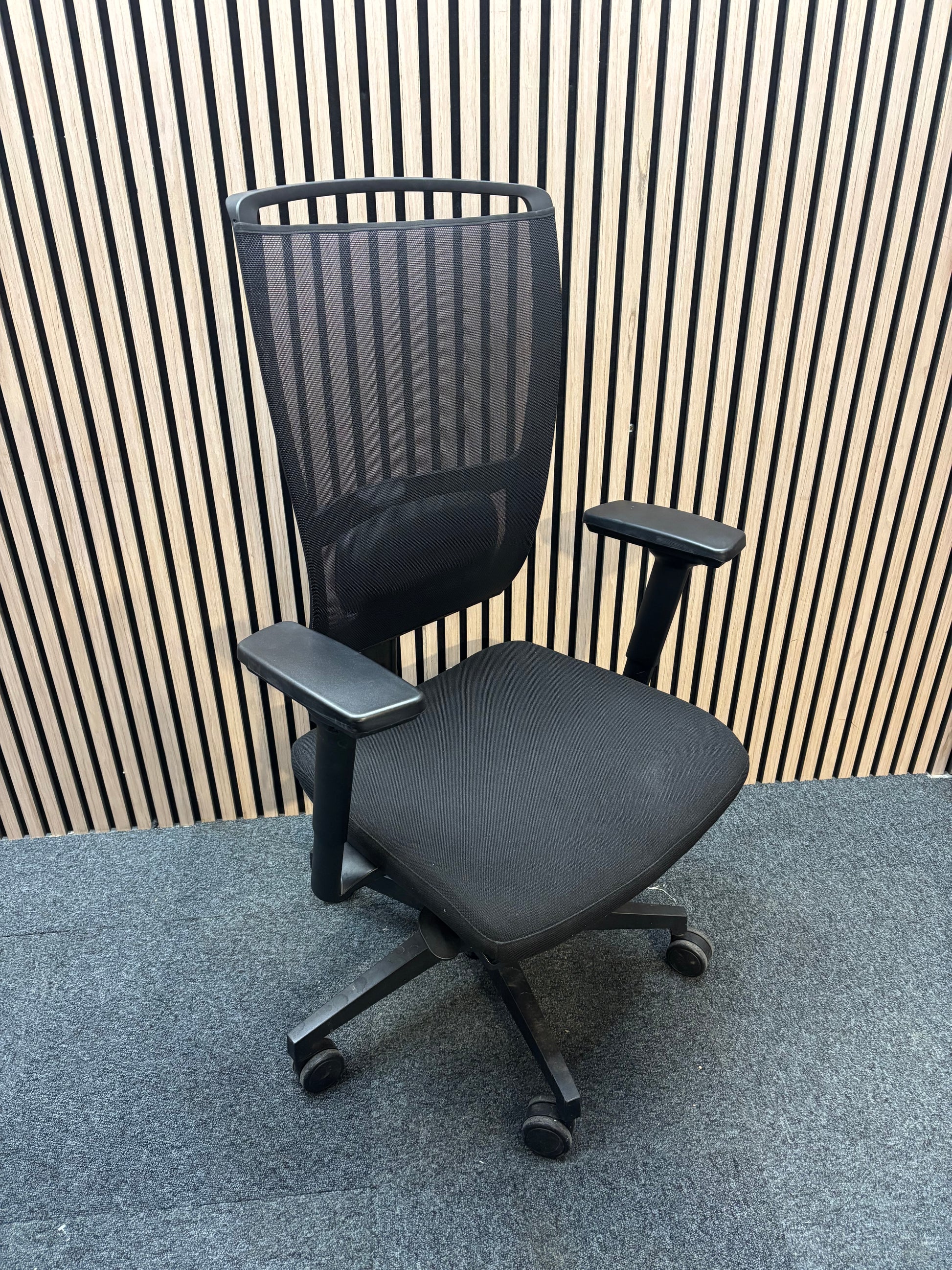 Black mesh back swivel chair with adjustable arms and 5 star swivel base