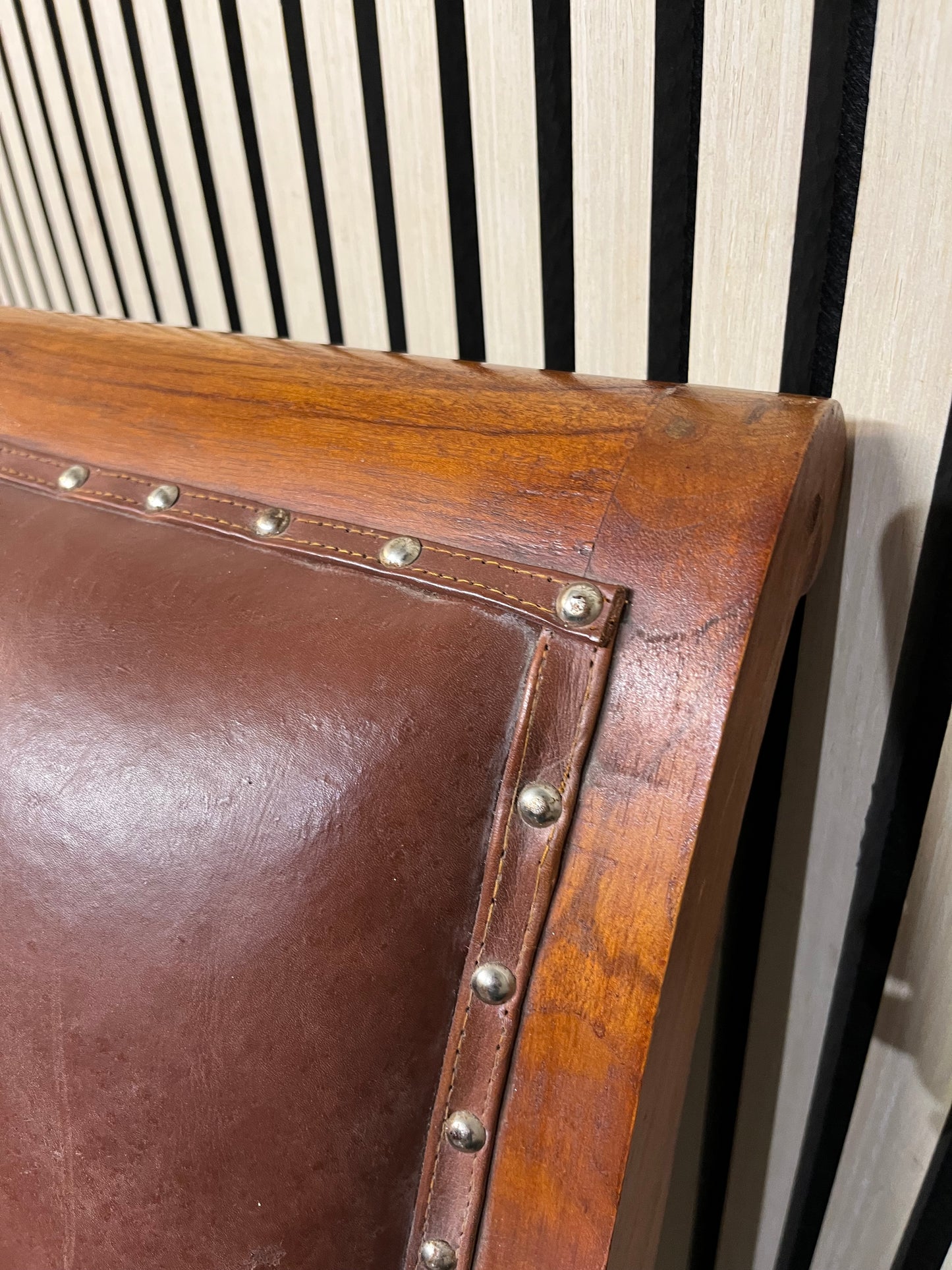 Ornate solid dark wood stained occasional armchair with brown leather studded seat 2425