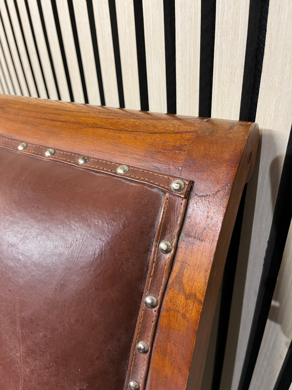 Ornate solid dark wood stained occasional armchair with brown leather studded seat 2425