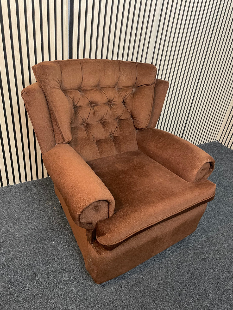 Brown fabric button back fireside armchair on castors 2425