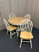 Round light wood dining table with four matching spindle chairs (diameter 105 cm + 45 cm extension)  44560