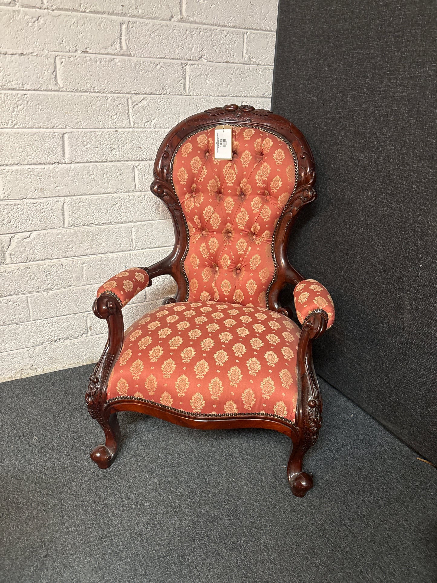 Large mahogany framed wing back armchair with wine and gold pattern fabric 3225