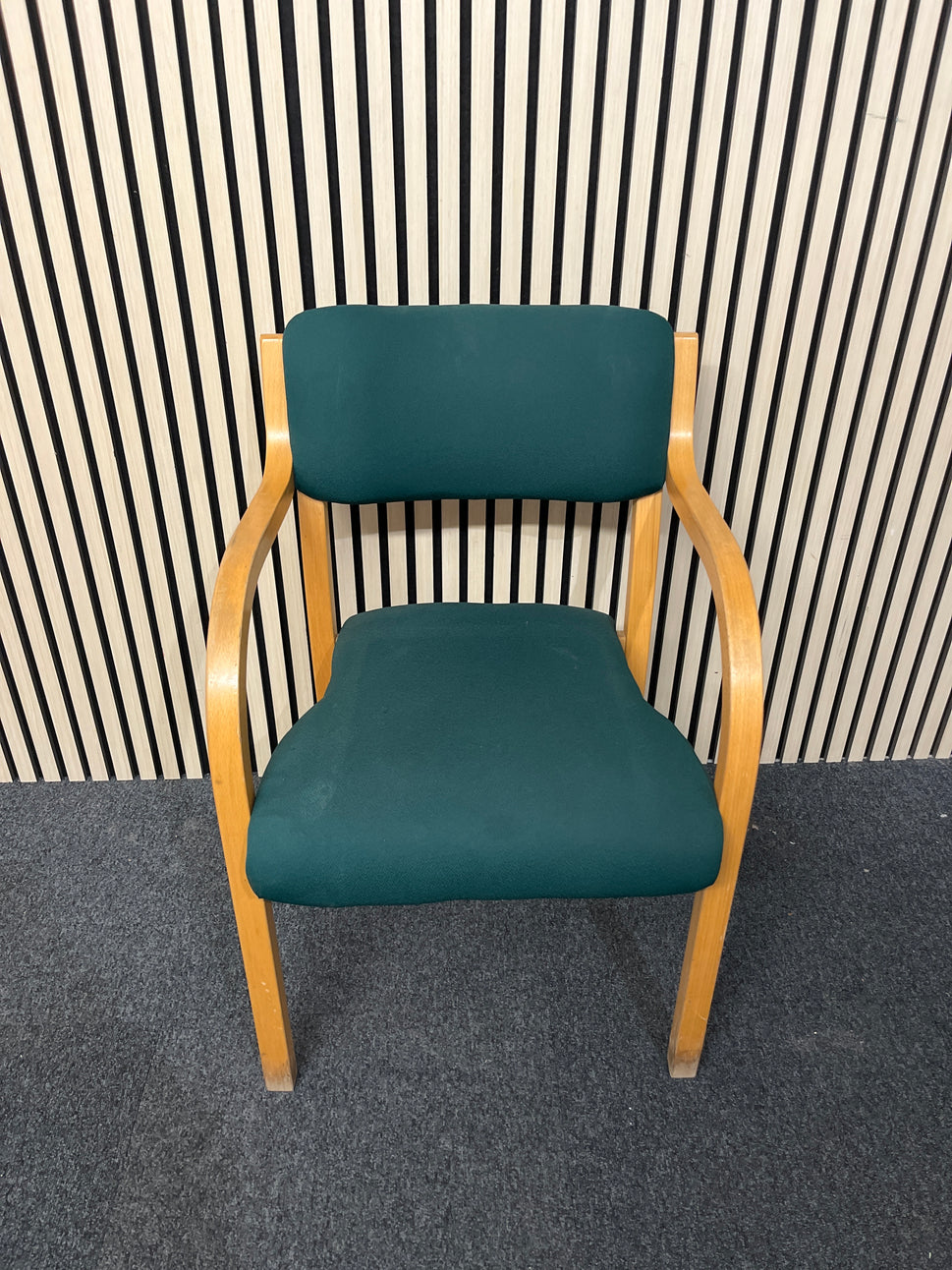 solid beech framed stacking chair with arms, green fabric seat and back