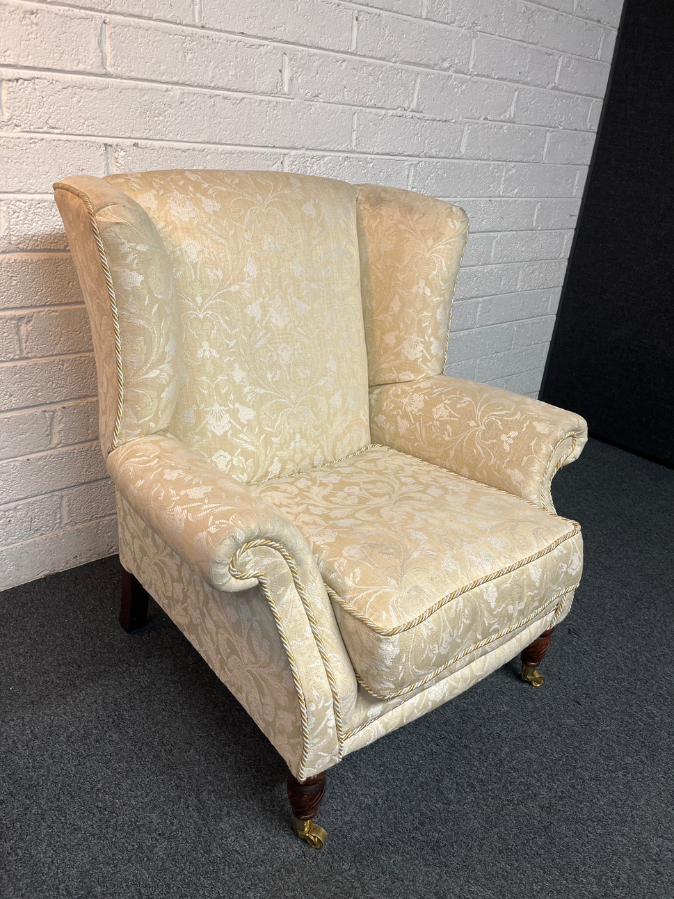 Cream mix fabric Queen Anne armchair solid wood frame, brass castors. 2225