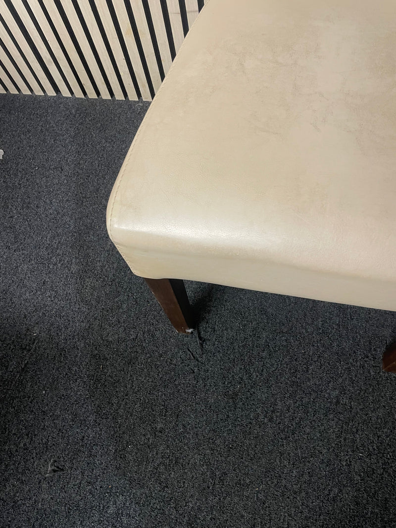 Pair of cream faux leather dining chair with dark wood legs.  44698
